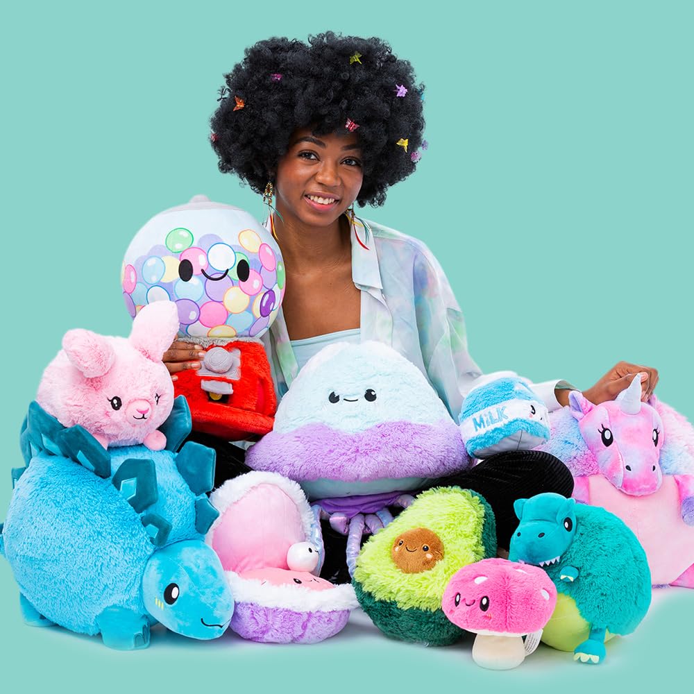 Squishable Mini Avocado in hand demonstrates portable comfort.