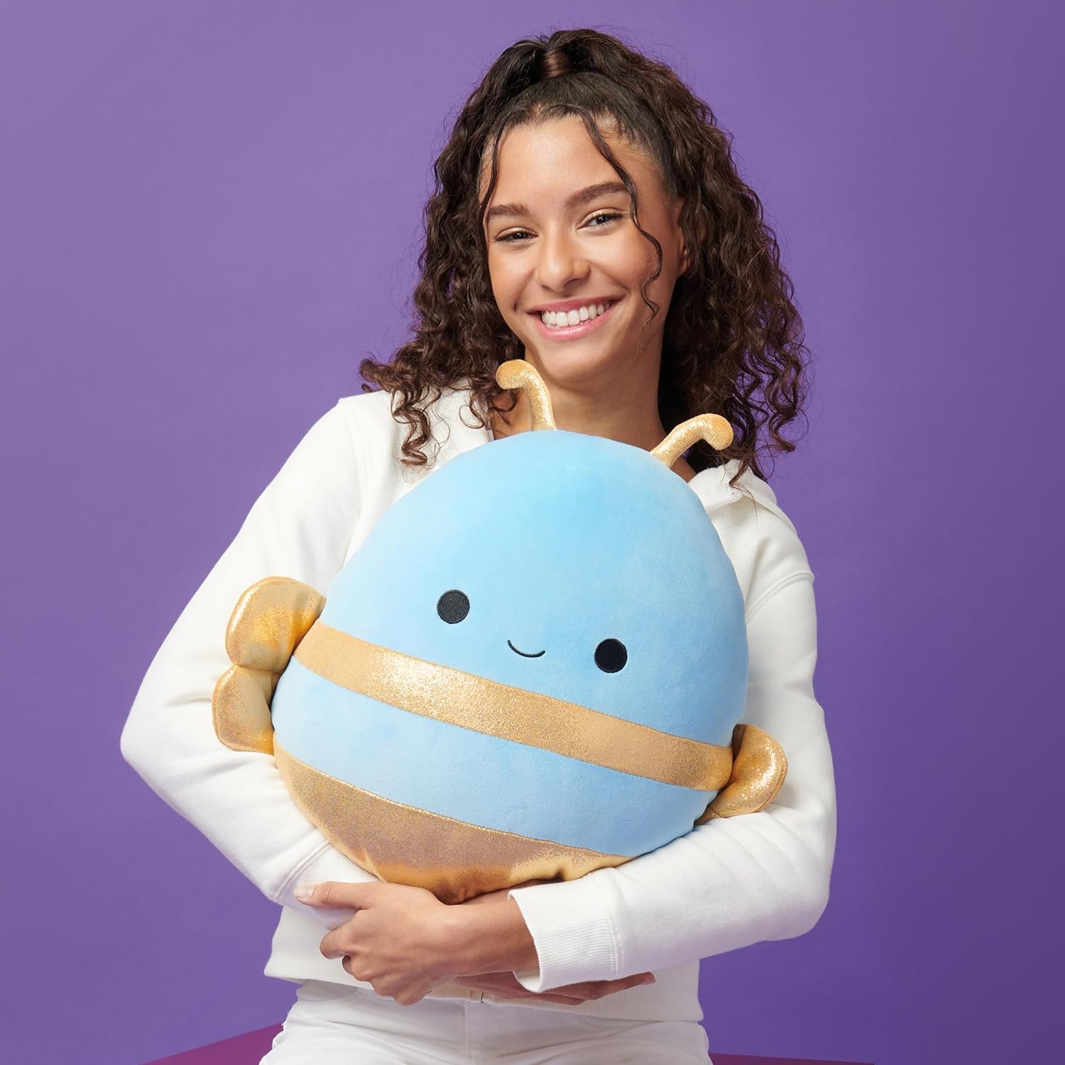 Squishmallows Queen Bee wings detail, sparkly gold accents for display or bedtime stories.