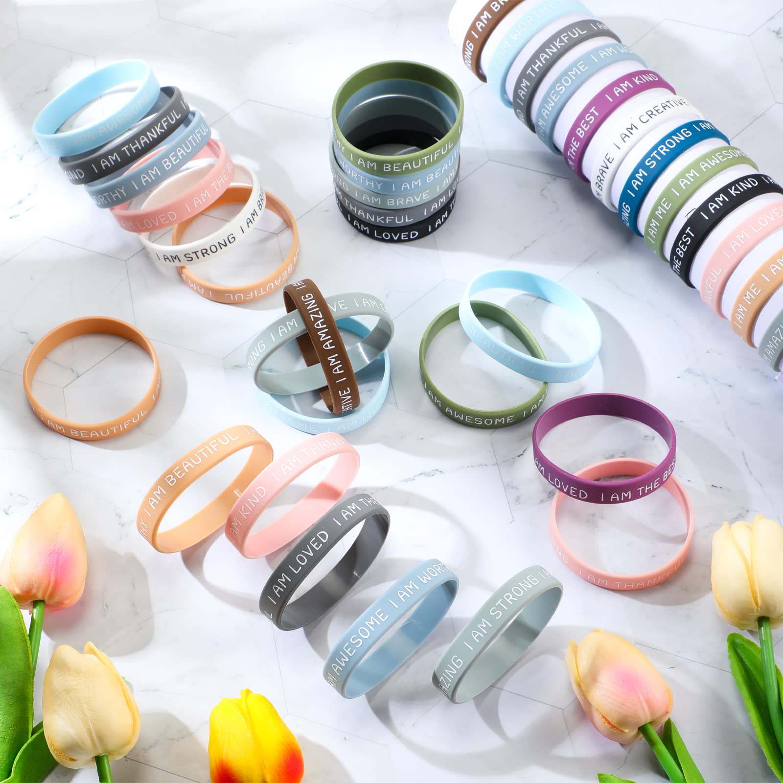 Sratte wristbands with motivational quotes to brighten outfits and days.