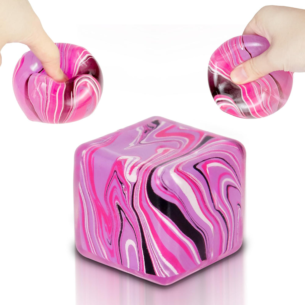Ssqauvig squishy cube pink in hand, ideal for portable stress relief during commutes
