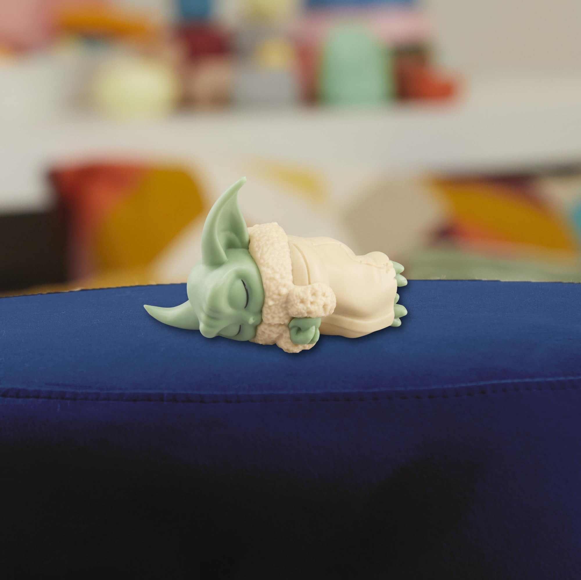 Compact 2.25-inch Grogu and 5-inch rancor fit on small shelves.