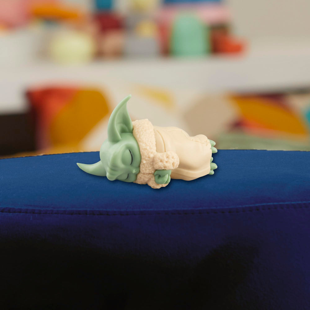 Compact 2.25-inch Grogu and 5-inch rancor fit on small shelves.