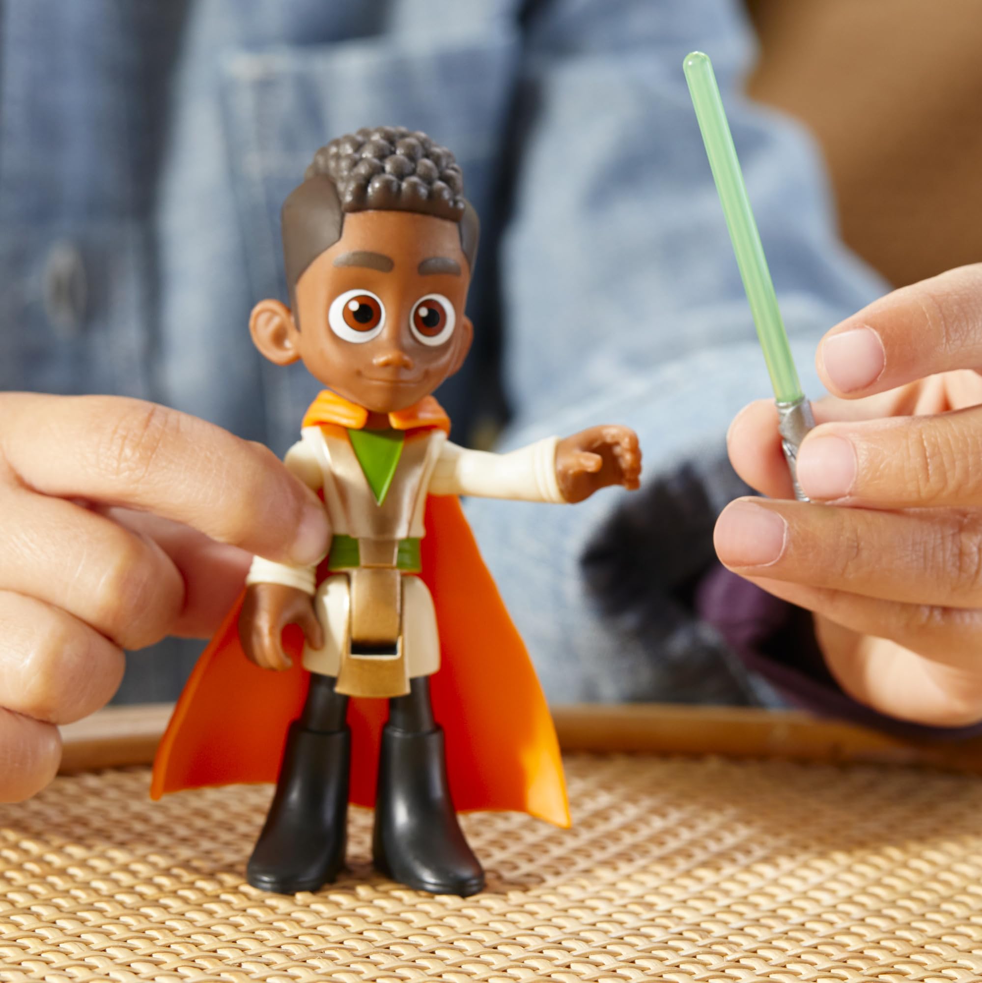 Removable cape enhances Kai Brightstar's costume-based play.
