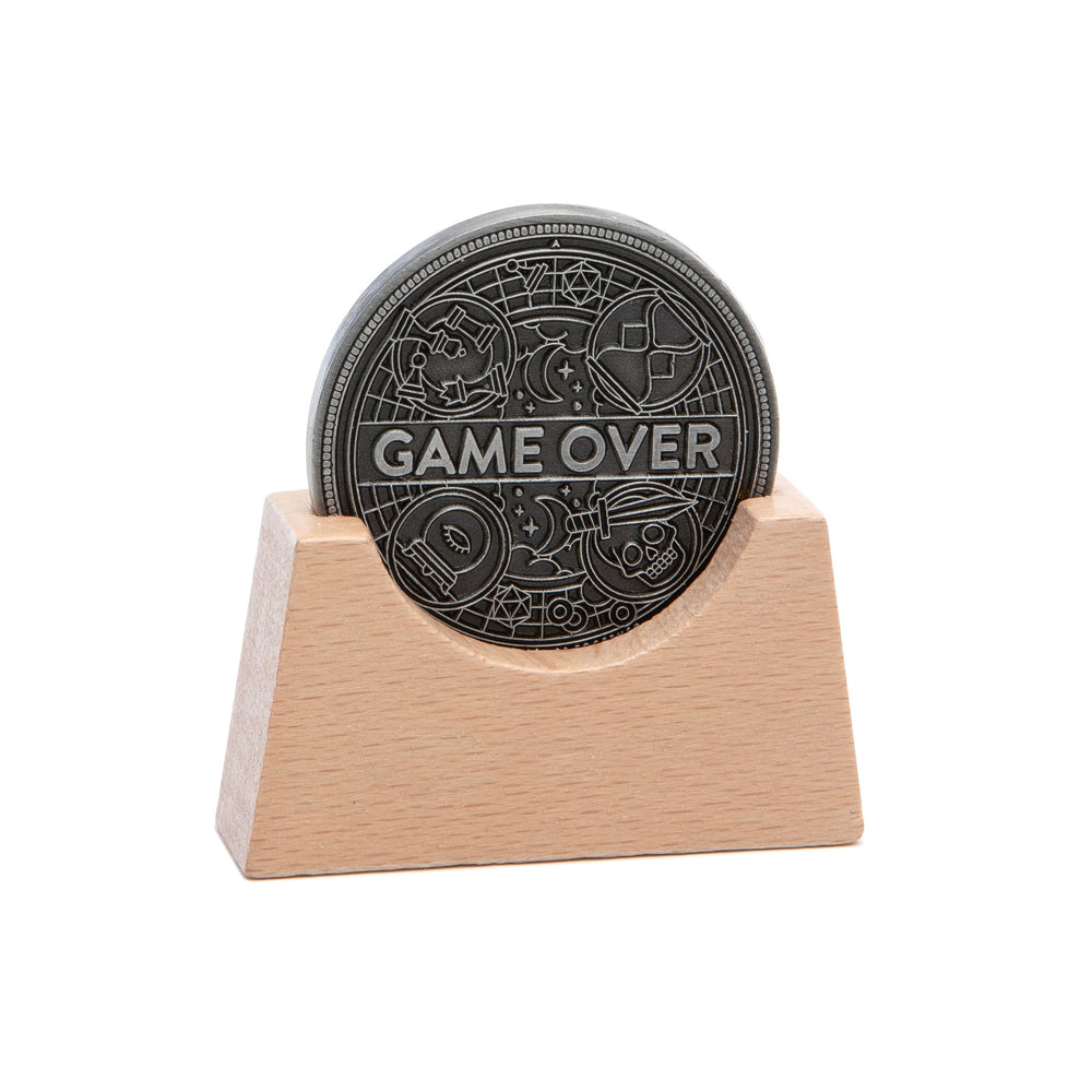 Stellar Factory Game Over Coin with wooden display stand for a desk display.