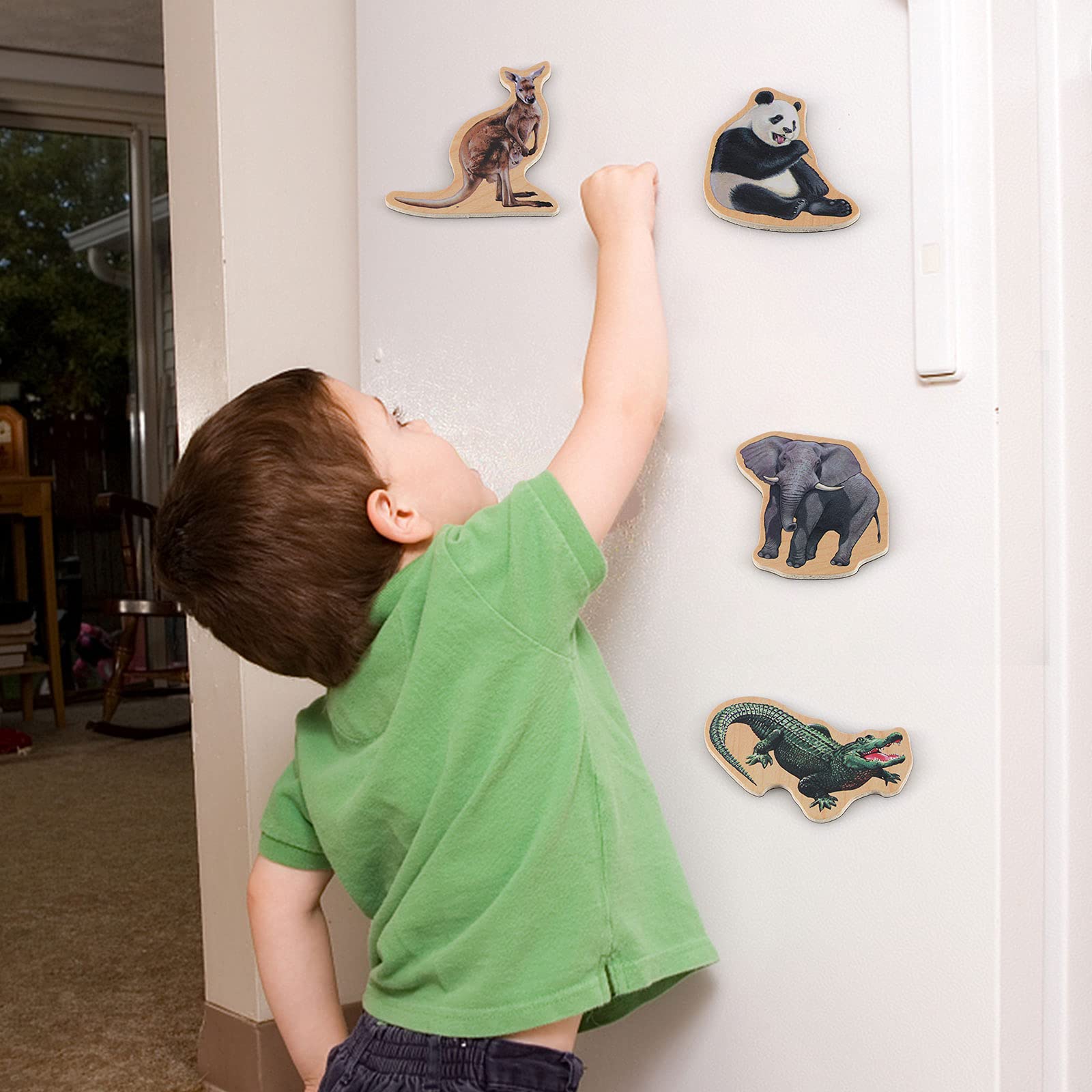 Steventoys animal magnets on refrigerator surface used for organization and play.