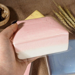 Sticky Bread slow rise squishy side view emphasizes dual-color design and portability.