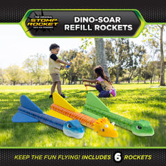 Stomp Rocket Dino-Soar rocket in flight demonstrates active outdoor play.