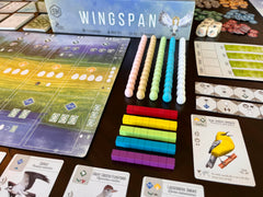 Stonemaier Wingspan box art panorama, striking visuals invite players to start a nature journey.