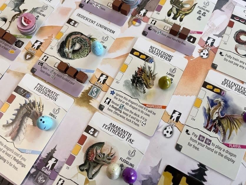 Stonemaier Wyrmspan illustrated-caves-dragons artwork enriching immersion
