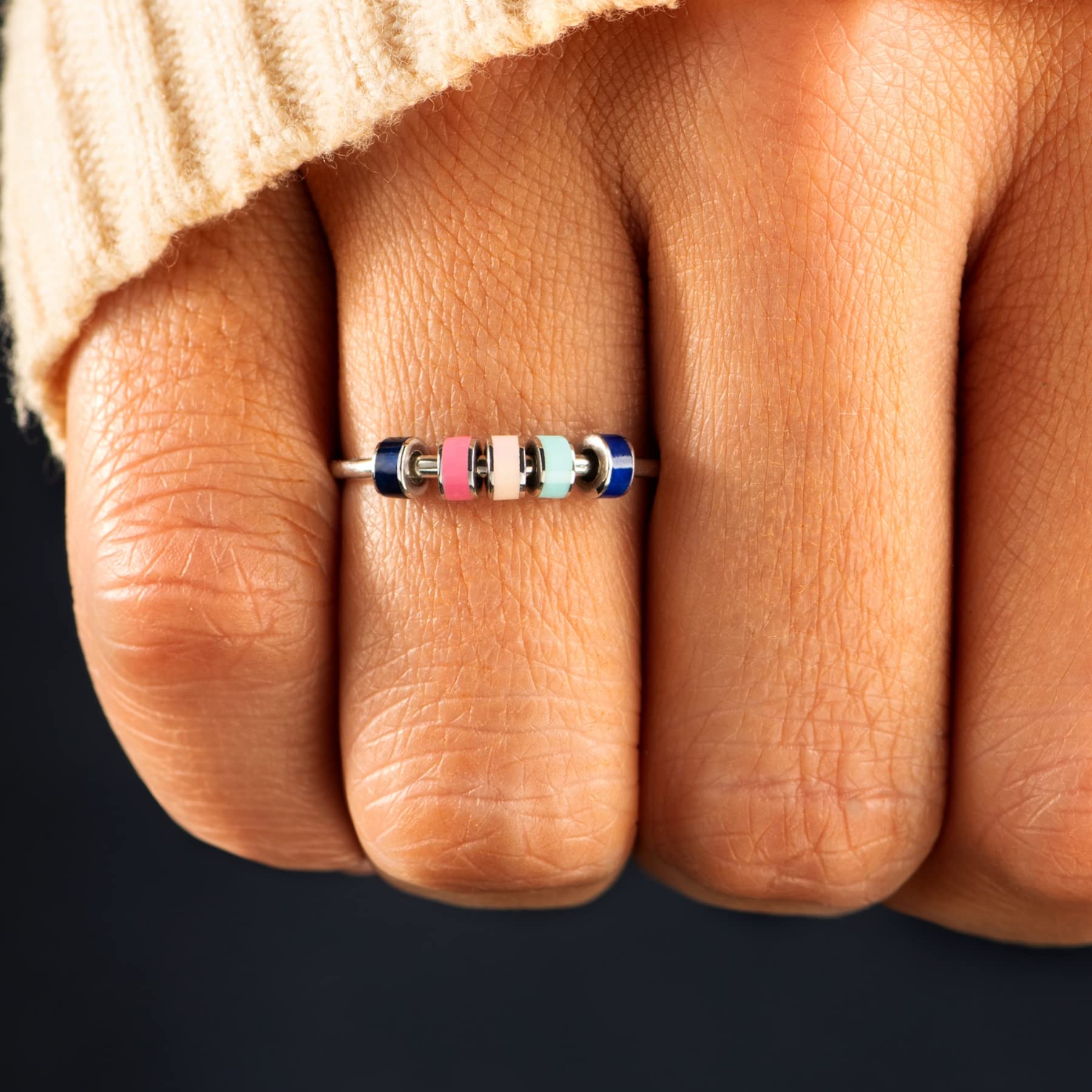 STORYJEWELLERY Spinner ring closeup highlighting smooth rotation.