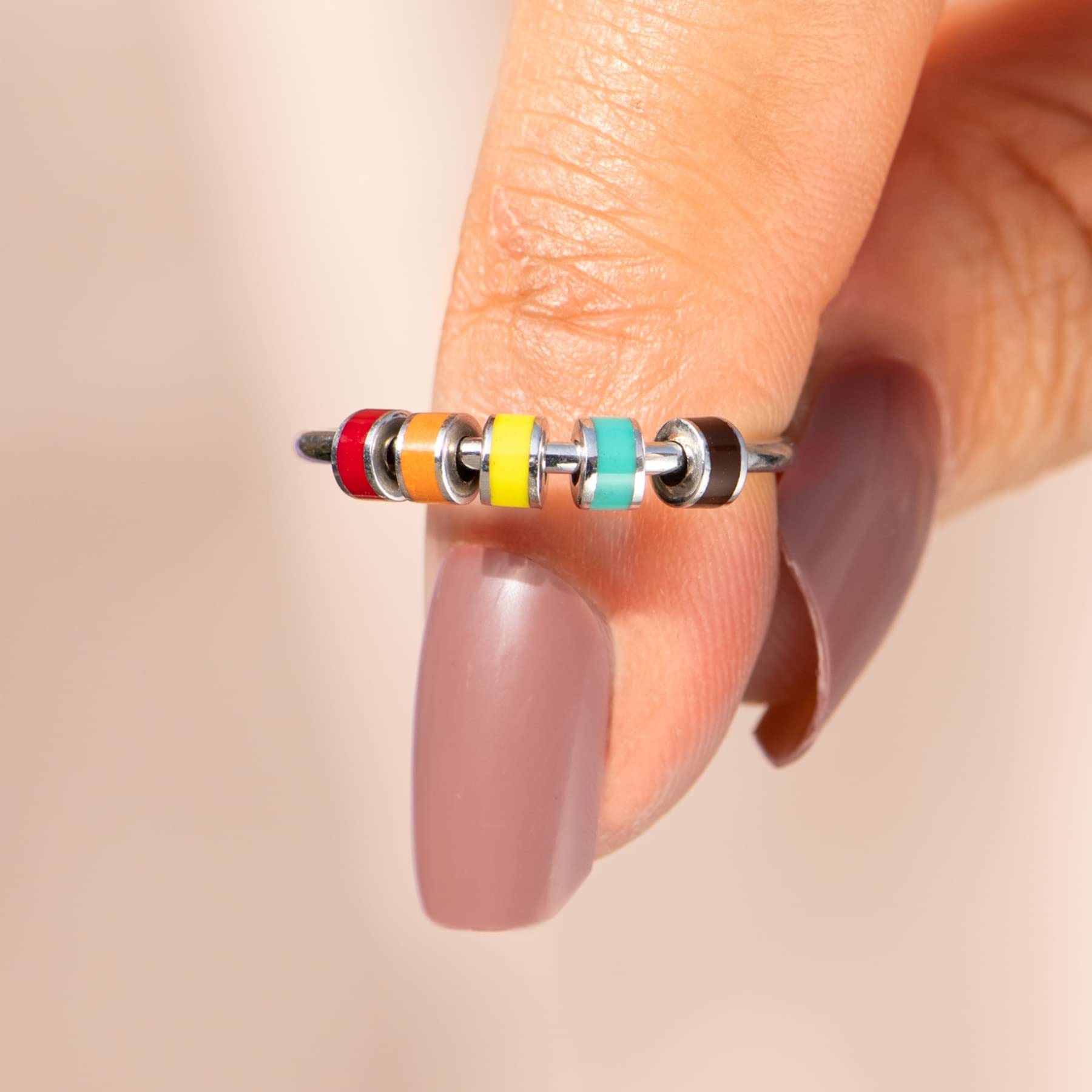 StoryJewellery Spinner Ring on finger demonstrating smooth rotation.