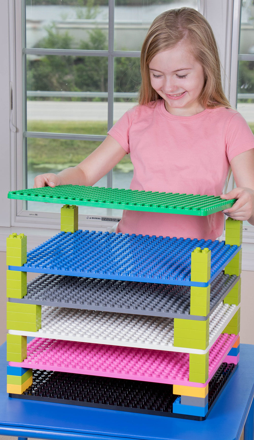 Strictly Briks green baseplate ready to stack with other baseplates for expansion