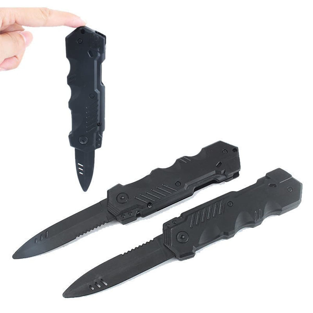 Sujosa black plastic dagger prop shows the spring-loaded retractable blade design.