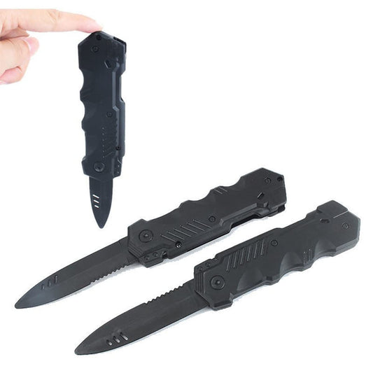 Sujosa black plastic dagger prop shows the spring-loaded retractable blade design.