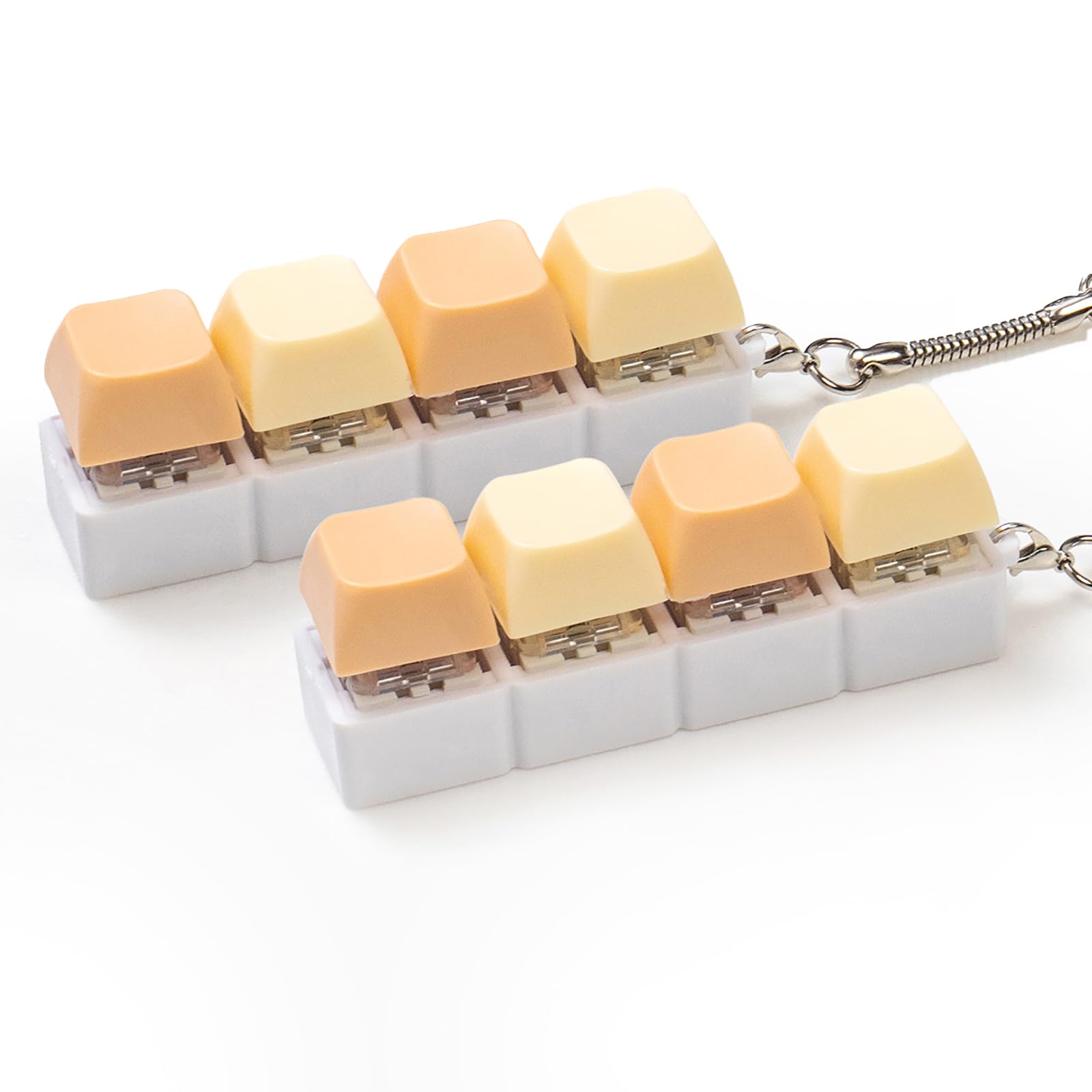 Sumgsn creamy keyboard fidget 2-pack on a clean desk for portable stress relief.