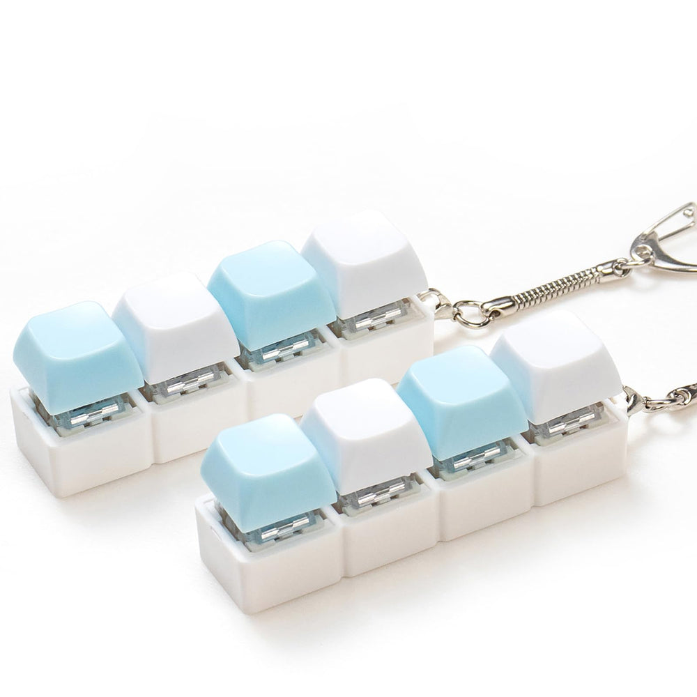 Sumgsn keyboard clicker with four keys held in hand for stress relief.