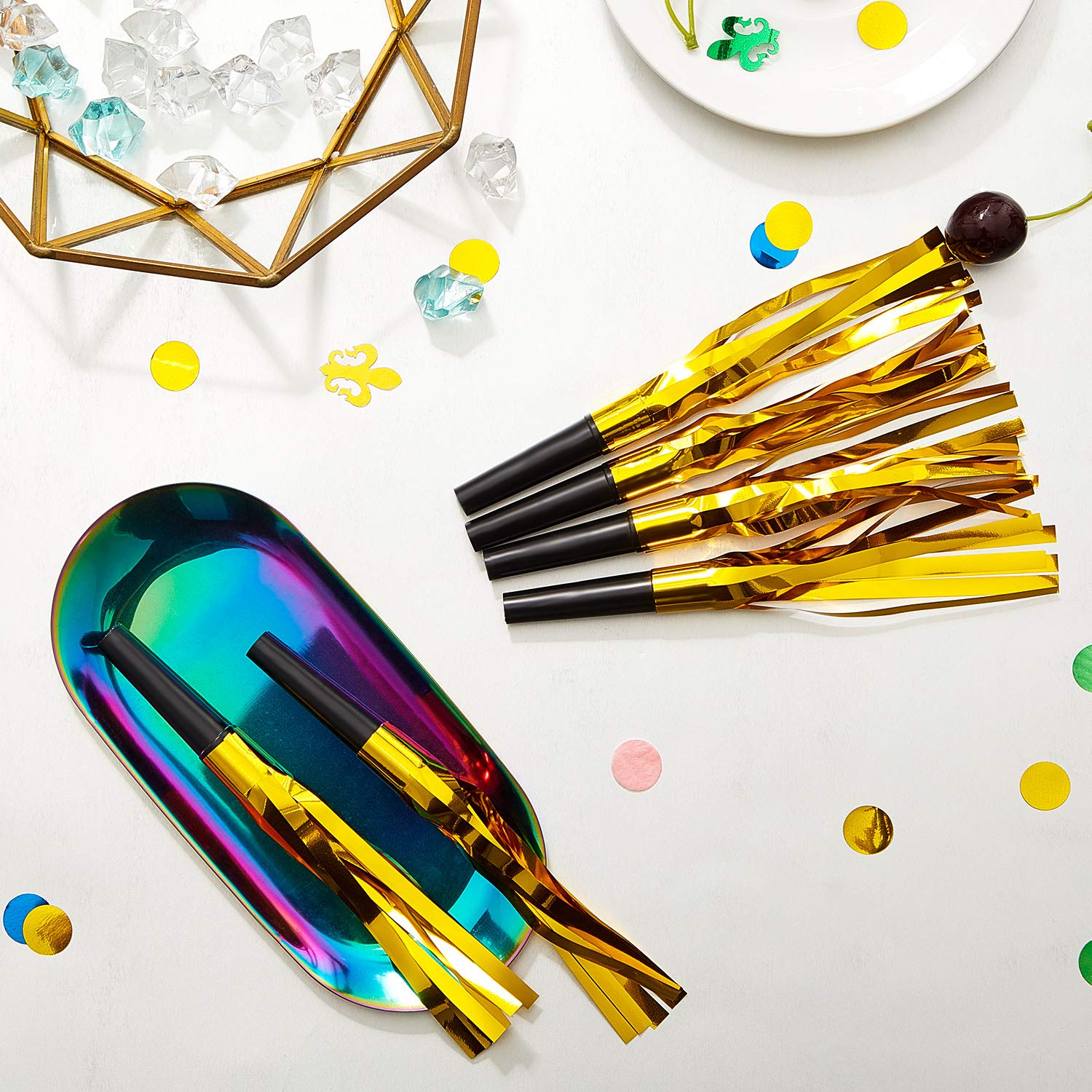 Sumind 24 gold noisemakers displayed for festive occasions.