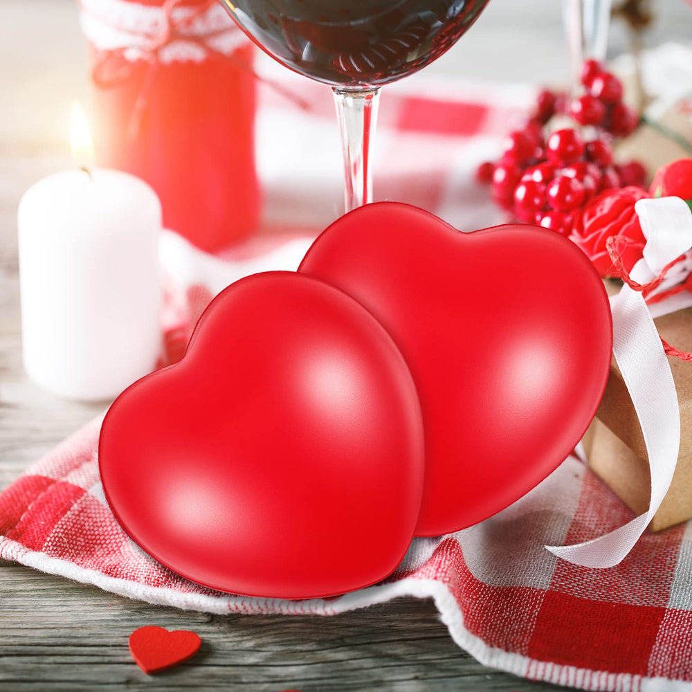 Sumind heart stress ball in hand shows squeeze relief.
