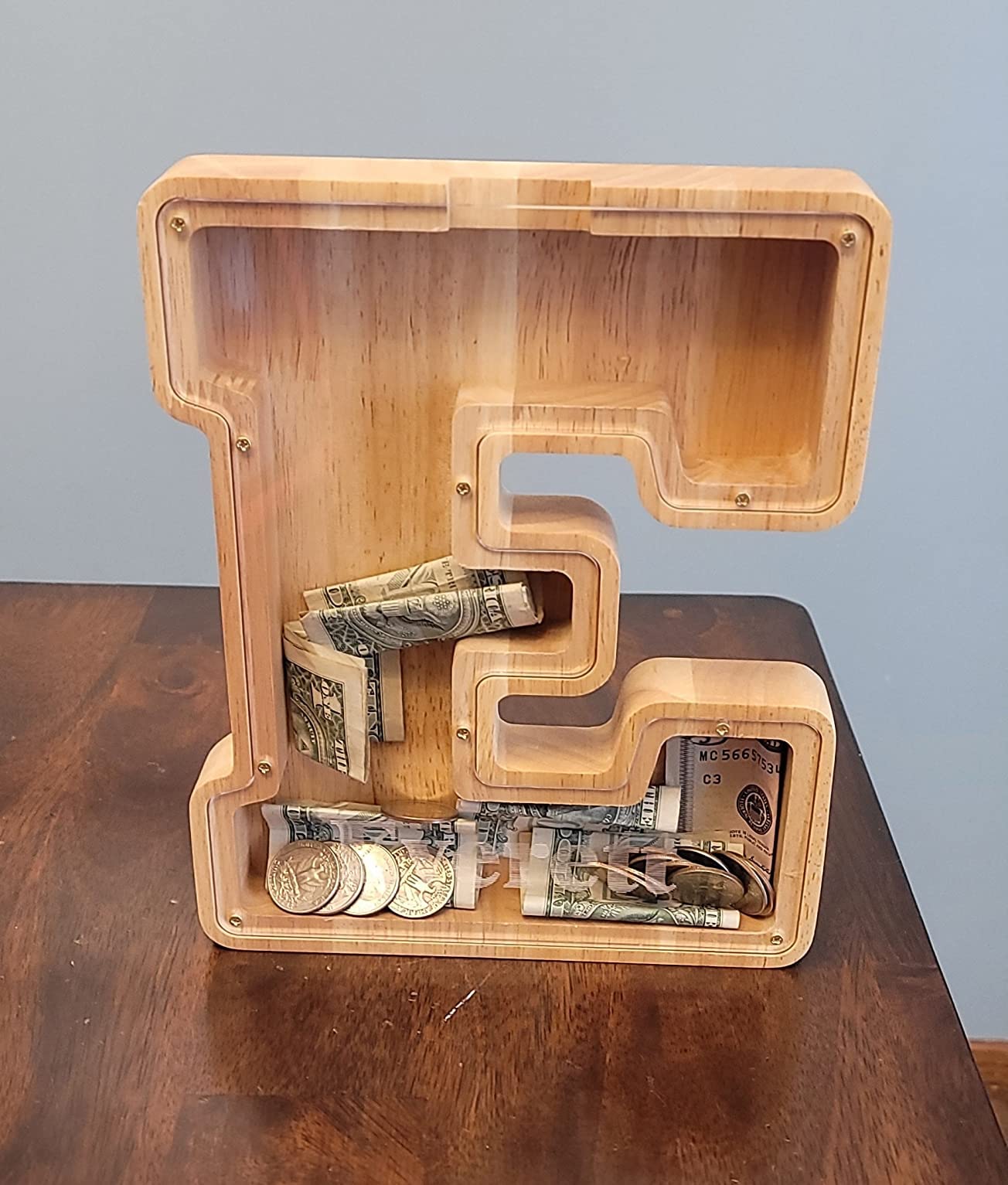 SummiDate 9-inch wooden piggy bank combines storage with decorative appeal