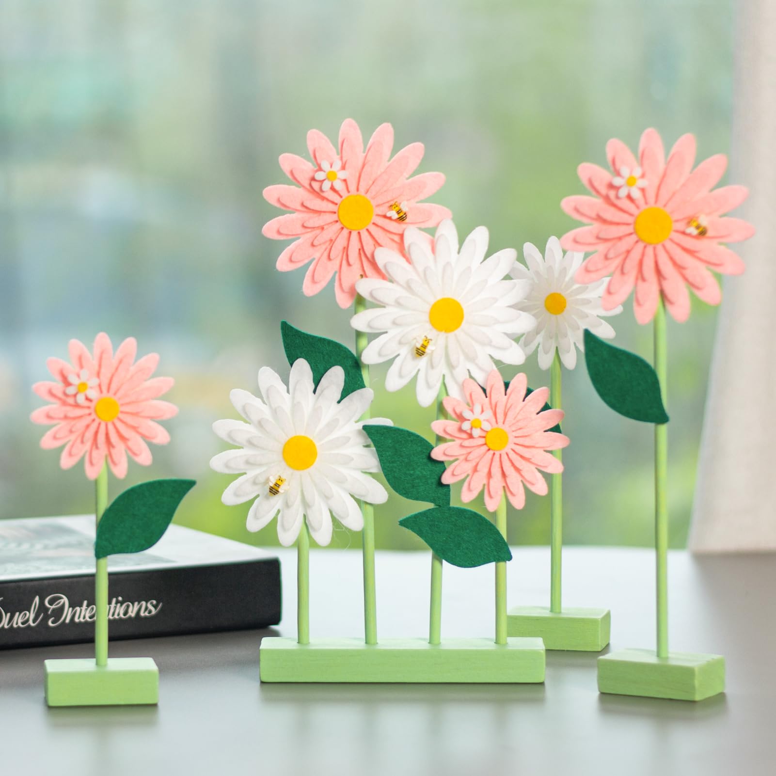 SUNBEAUTY felt daisy centerpiece enhances dining ambiance.