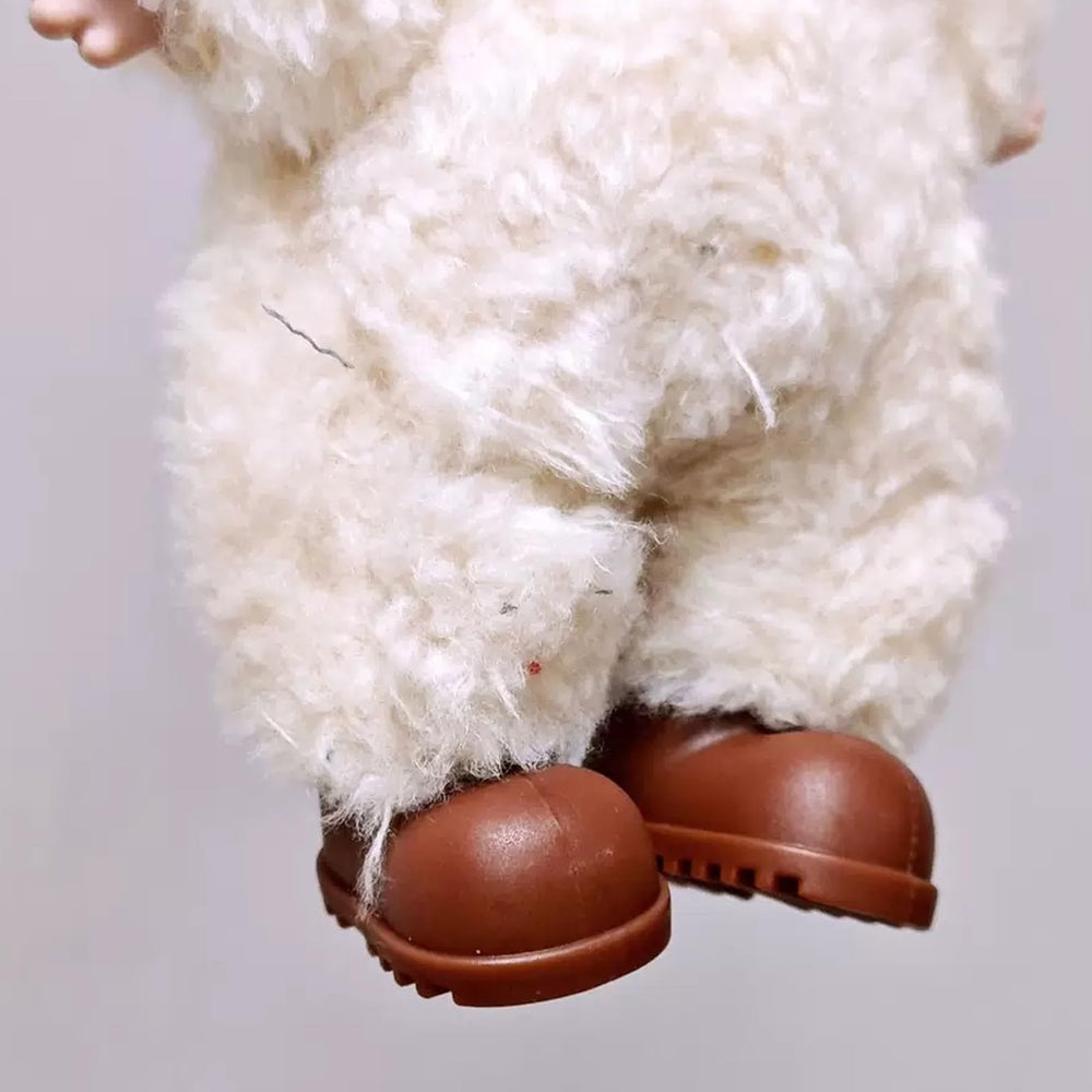 Close-up of silicone texture shows flexible, non-slip grip for safe doll posing.