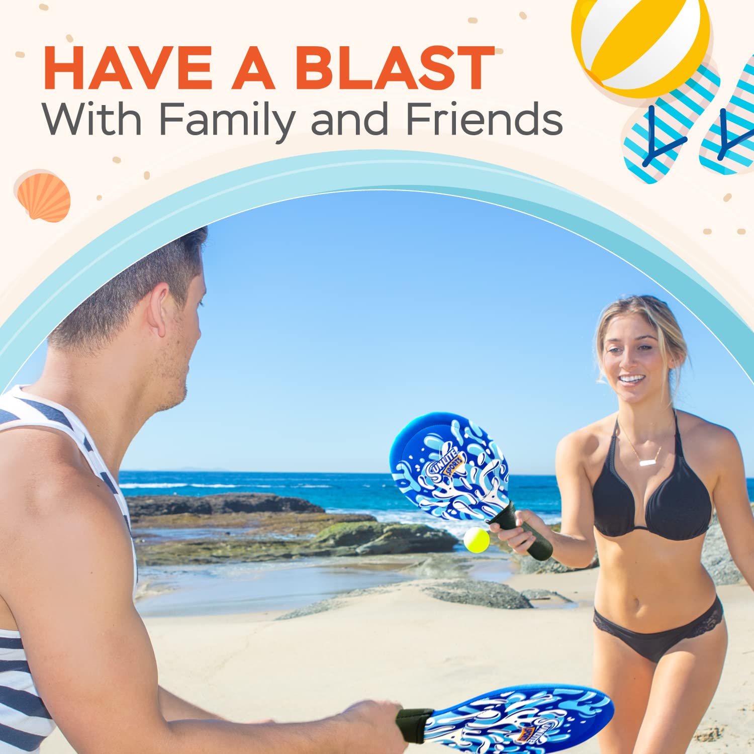 Sunlite Sports blue paddle set contrasts vividly with sand and grass.