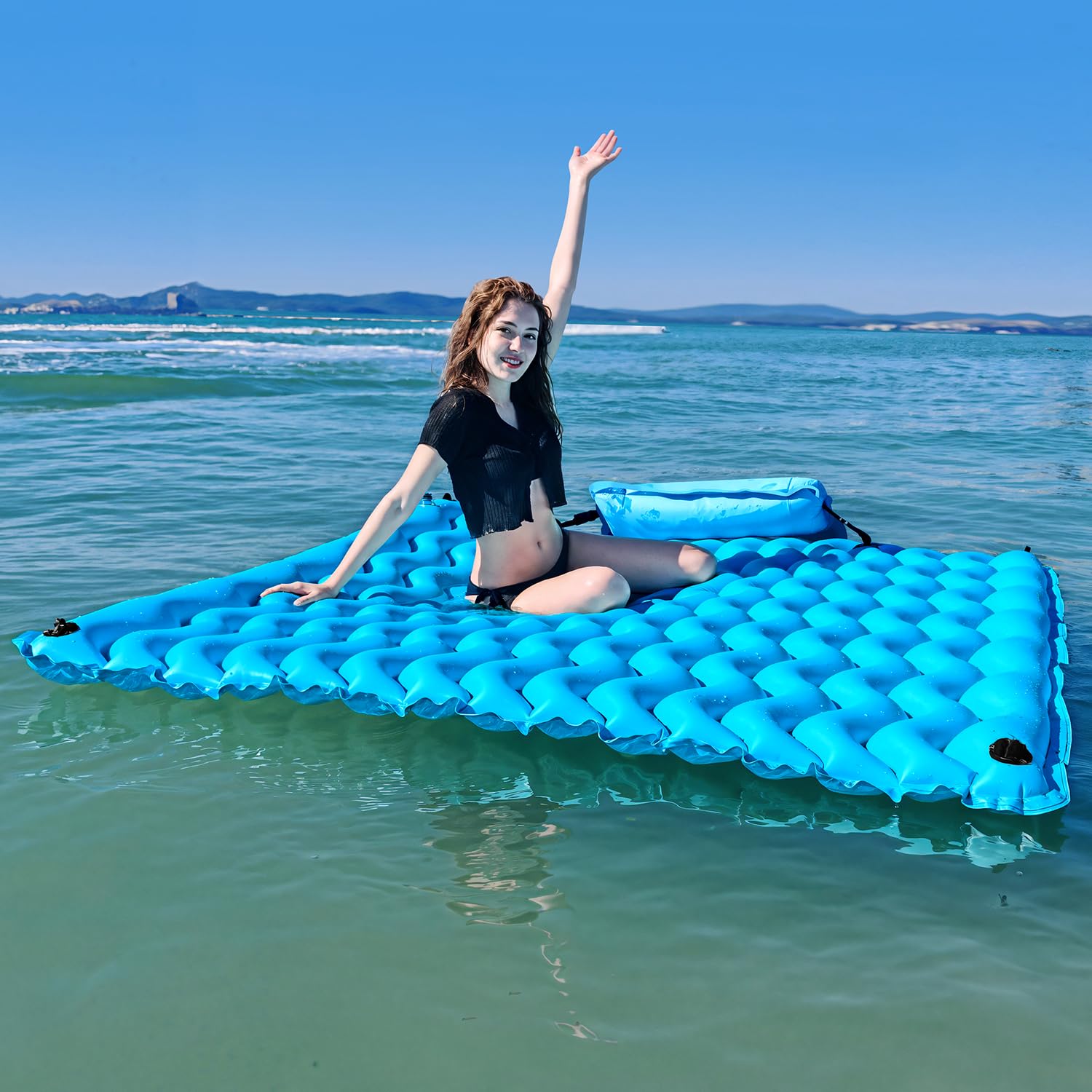 Sunrio giant floating mat blue provides stable lounging surface on water.