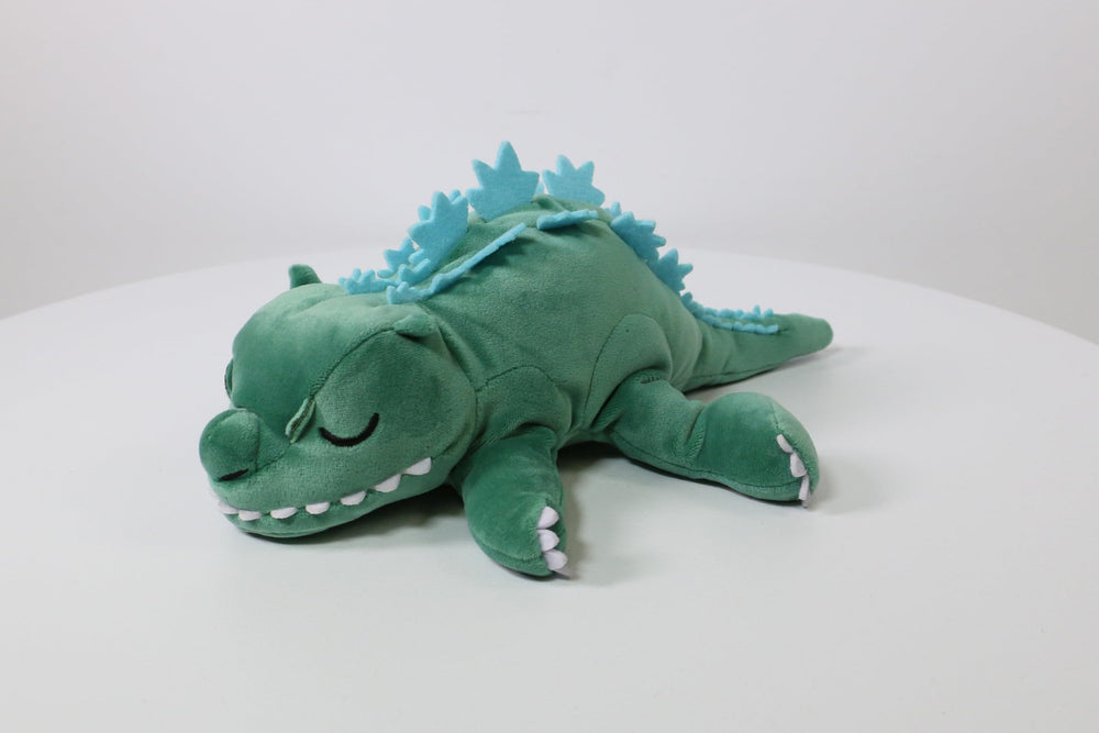 Texture close-up on Surreal Entertainment Godzilla plush surface for tactile appeal.