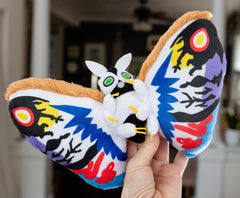 The 10-inch Rainbow Mothra plush is ideal for shelves or quick hugs.