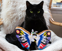 Officially licensed Rainbow Mothra plush enhances any kaiju collection.