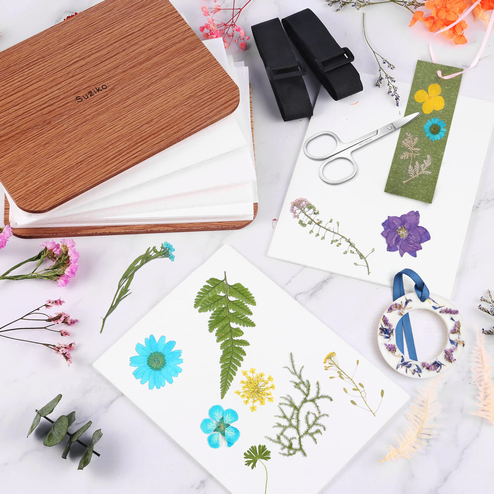 Suziko lining paper protects petals during press, improving results.