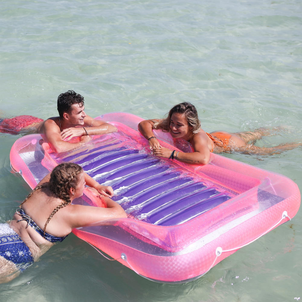 Swimline Original Suntan Tub Classic pink purple with integrated headrest for extra comfort.