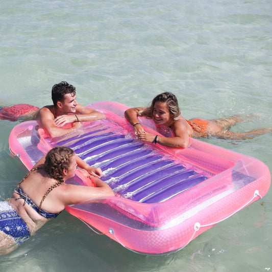 Swimline Original Suntan Tub Classic pink purple with integrated headrest for extra comfort.