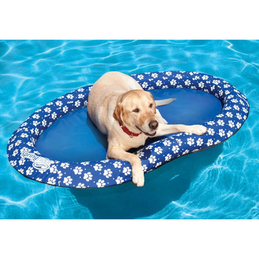 SwimWays Paddle Paws blue dog raft in use on the water with a large dog