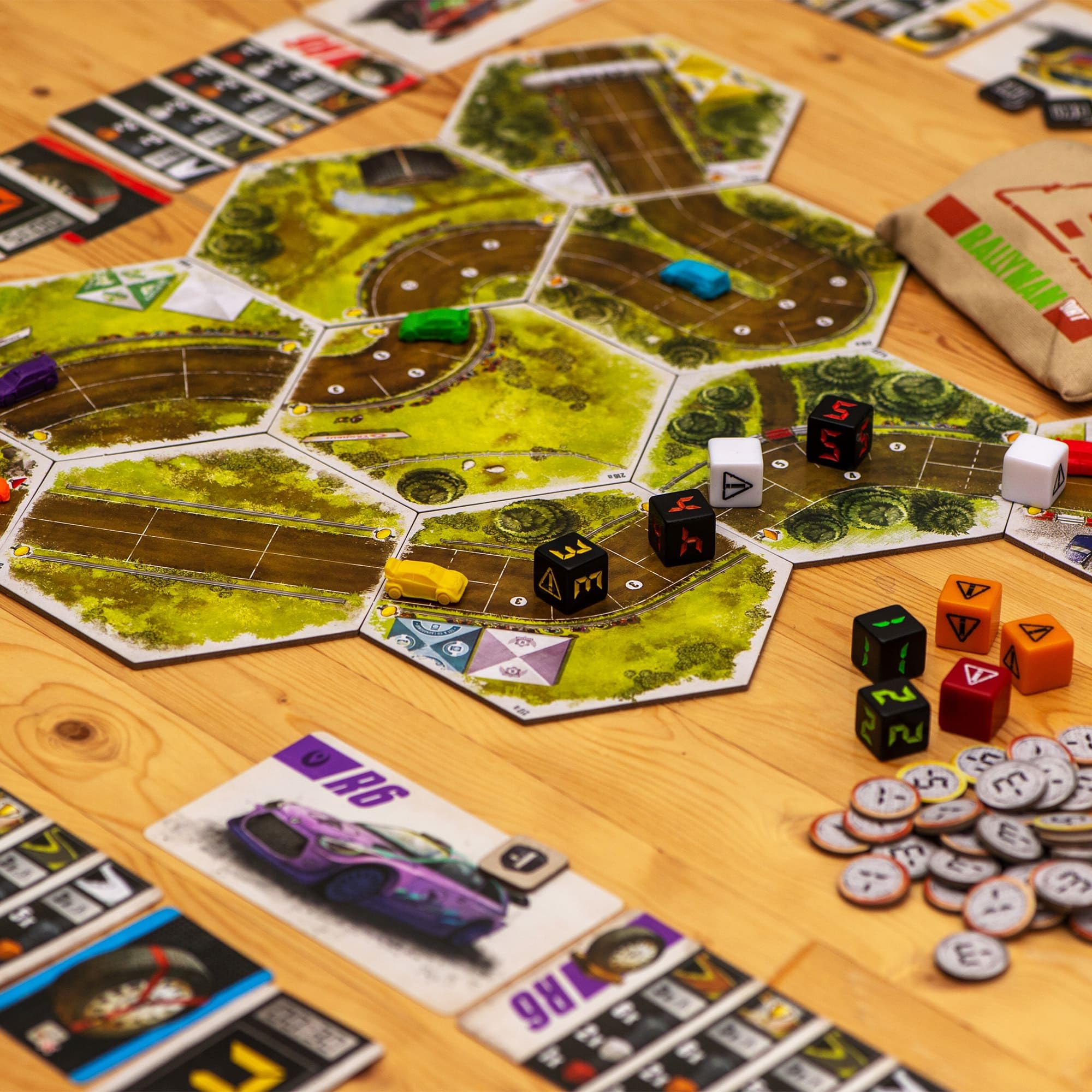 Synapses Games Rallyman DIRT tabletop setup on a racing map.