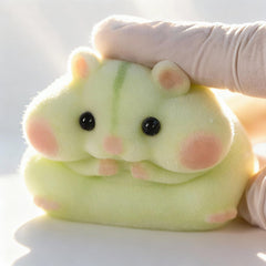 Taba squishy hamster toy furry texture closeup promotes soothing sensory appeal.