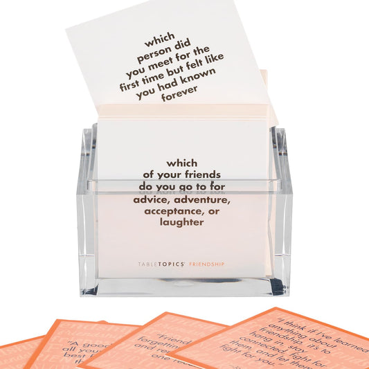 TableTopics girls night setup with colorful cards for fun, inclusive discussions.