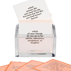 TableTopics girls night setup with colorful cards for fun, inclusive discussions.