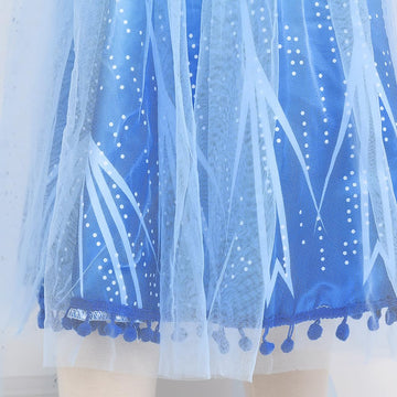 Tacobear dress hem pom-poms create playful movement during dances.