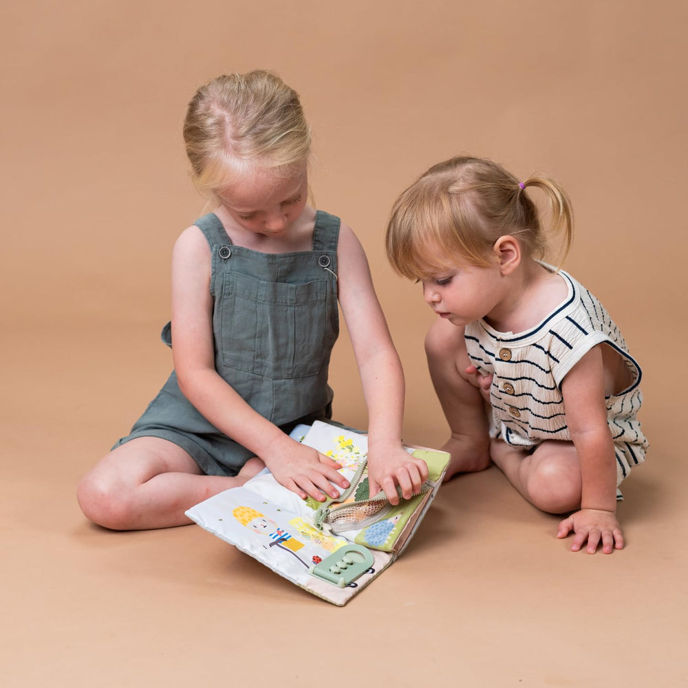 Taf Toys Busy Book durable fabric design withstands enthusiastic toddler play.