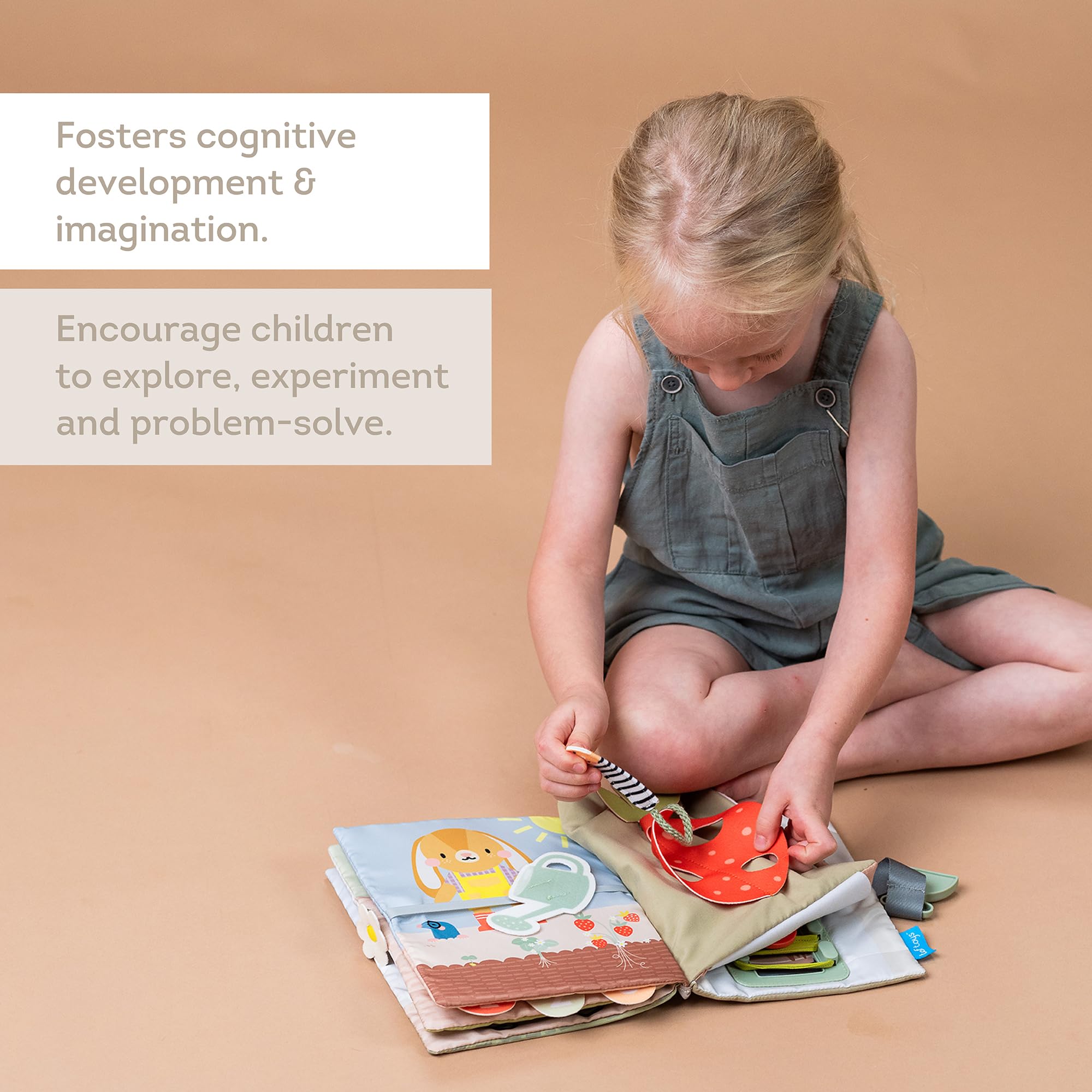 Taf Toys Busy Book soft fabric pages are gentle for tiny hands.