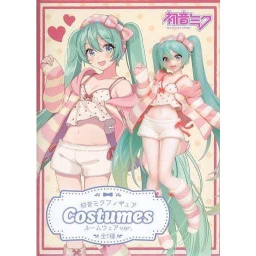Taito Hatsune Miku plush and base stand, perfect for desk or shelf.