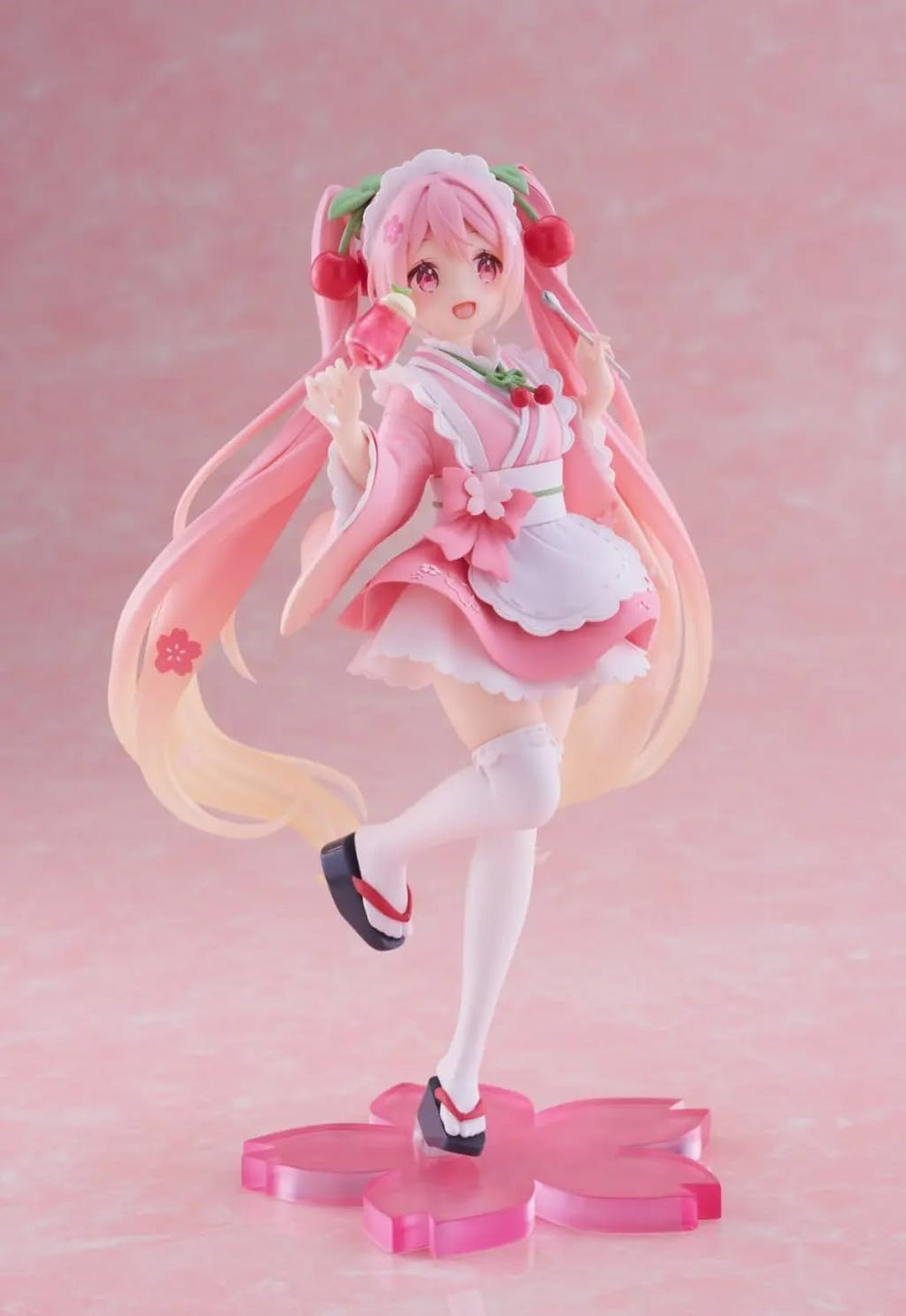 Taito Sakura Miku figure base stand included for stability.