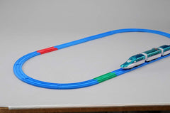 Takara Tomy Plarail S-16 E5 Hayabusa side view highlights smooth operation on standard rails.