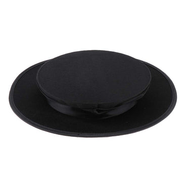 Taotenish child wearing top hat demonstrates portable party accessory for celebrations.