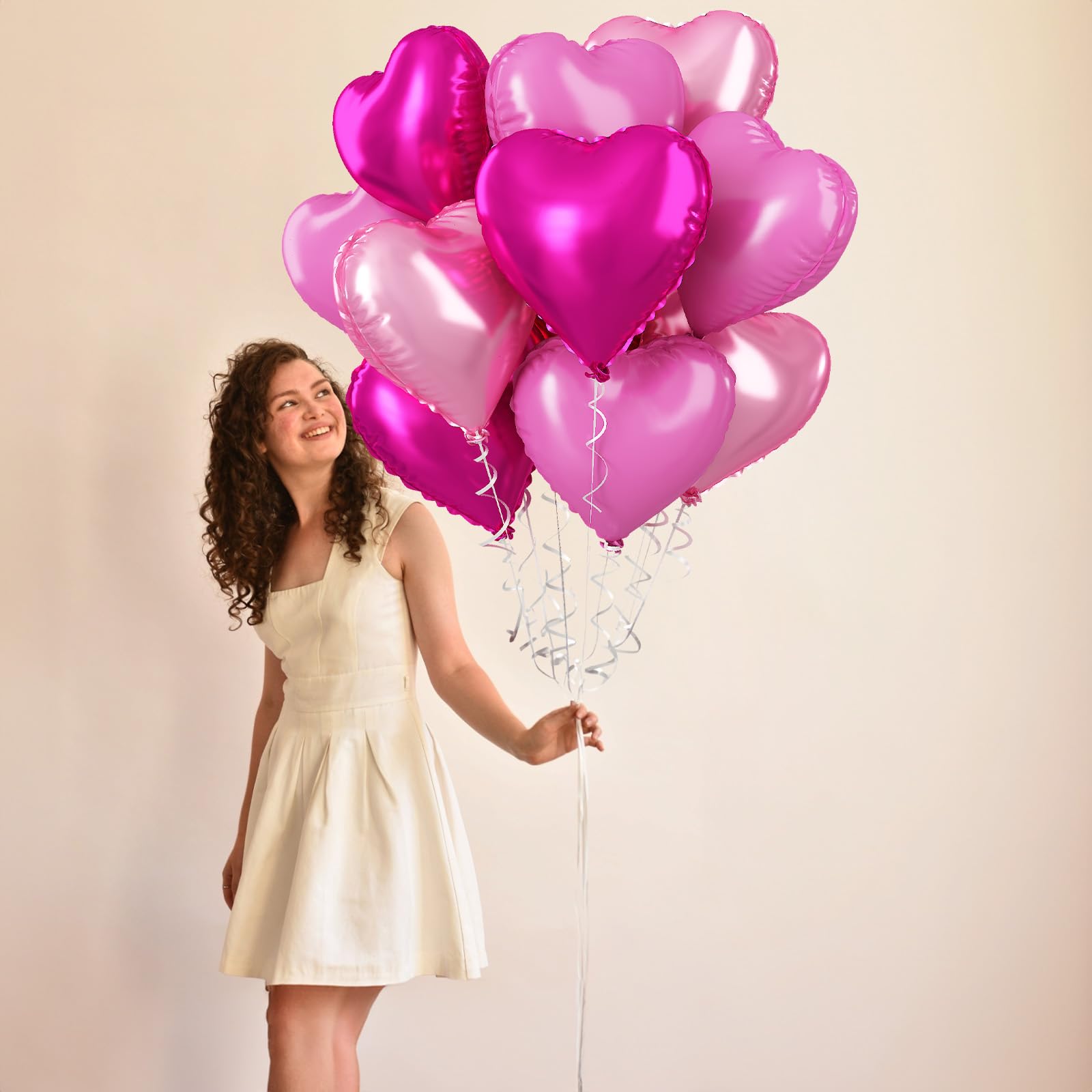 TAOYE hot pink heart balloons add bold focal points to events.