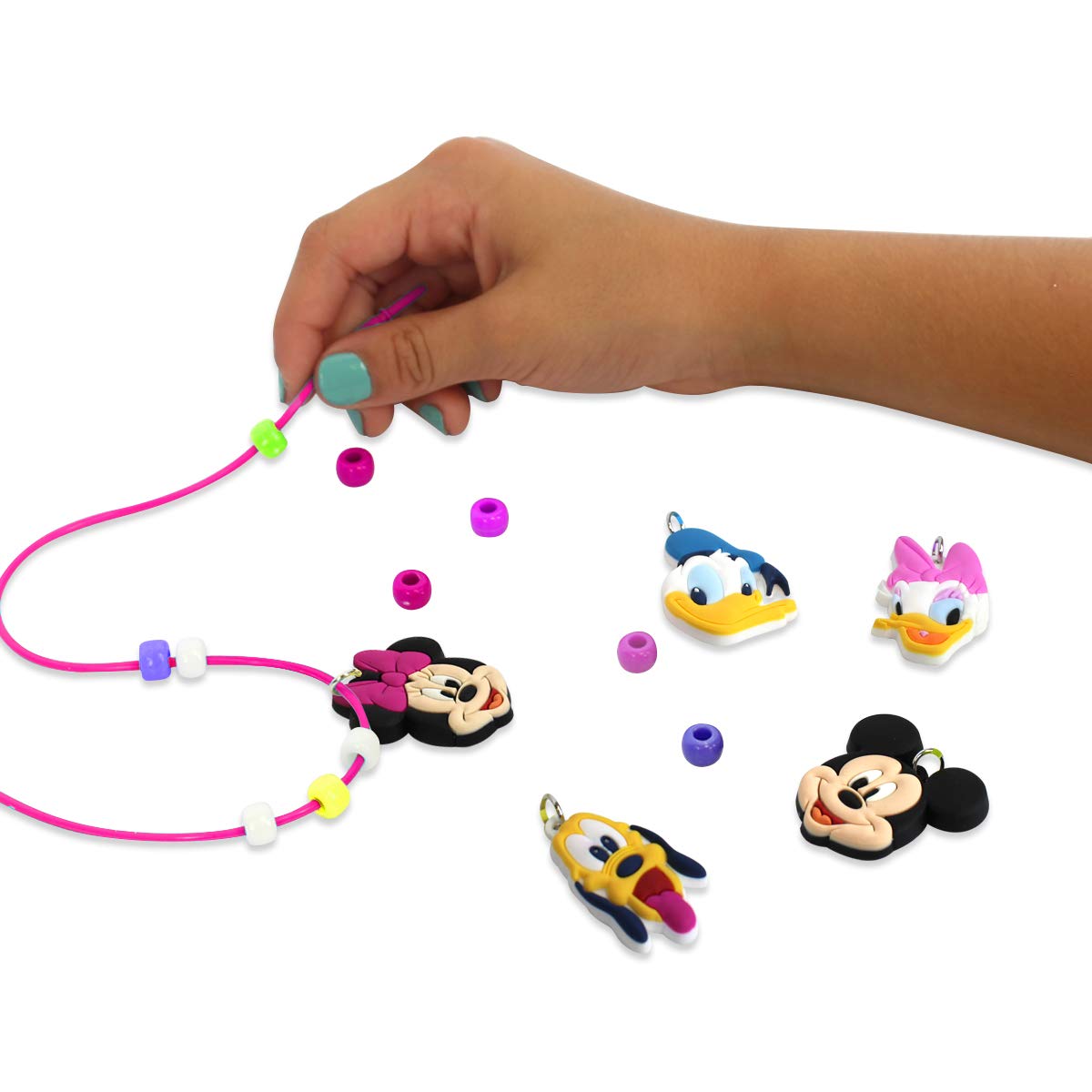 Five Minnie charms add character to DIY jewelry in the Tara Toys set.