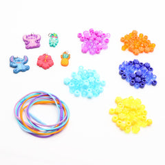 Child assembling Stitch necklaces with beads and charms