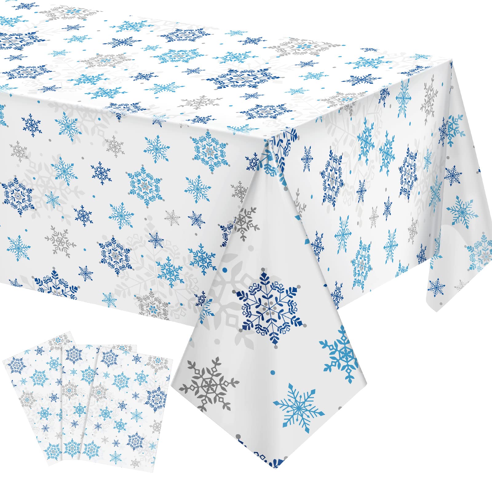 Tatuo Christmas Snowflake tablecloth with blue and white pattern on a dining table.