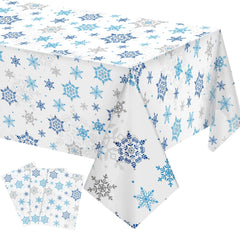 Tatuo Christmas Snowflake tablecloth with blue and white pattern on a dining table.